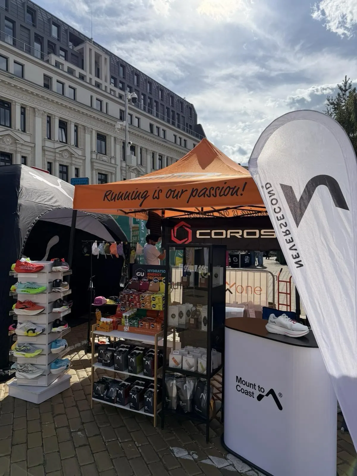 RZ Performance / Running Zone expo tent at the 43rd Wizz Air Sofia Marathon, with COROS, Mount to Coast and Neversecond branding